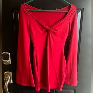 Women’s long sleeve bodycon dress. Bell sleeve, square neck, and low cut.